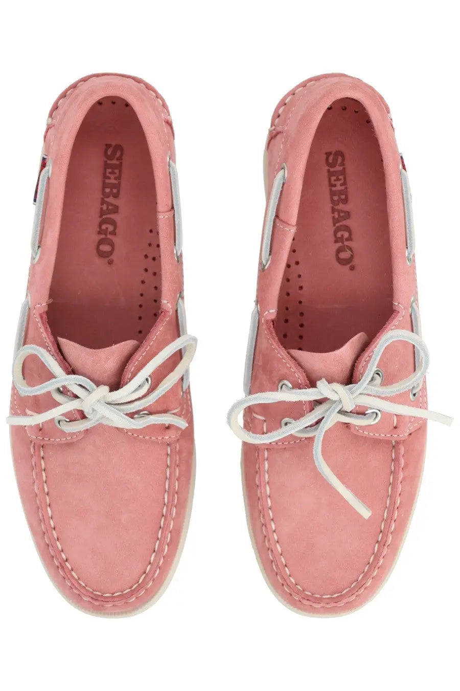 Pink suede seabag boat shoes with white laces and stitching from sebago women’s mocassino docksides collection