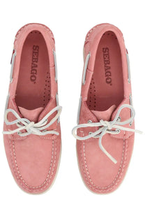Pink suede seabag boat shoes with white laces and stitching from sebago women’s mocassino docksides collection