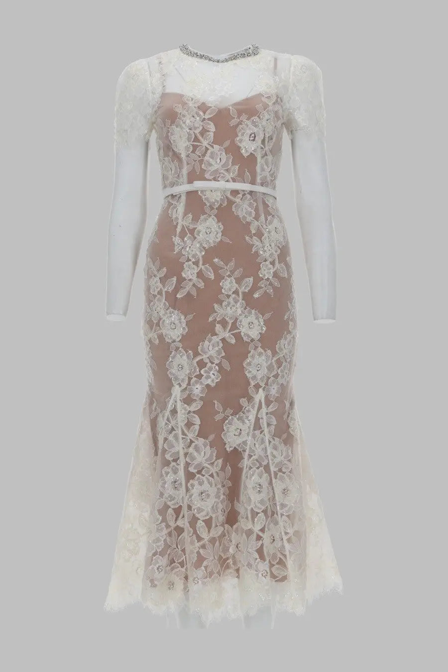 A delicate ivory lace mermaid dress with floral embroidery and matching belt from self-portrait white collection