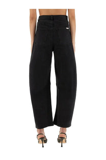 Black wide-leg denim jeans with high waist and classic back pockets shown from the back side by self-portrait