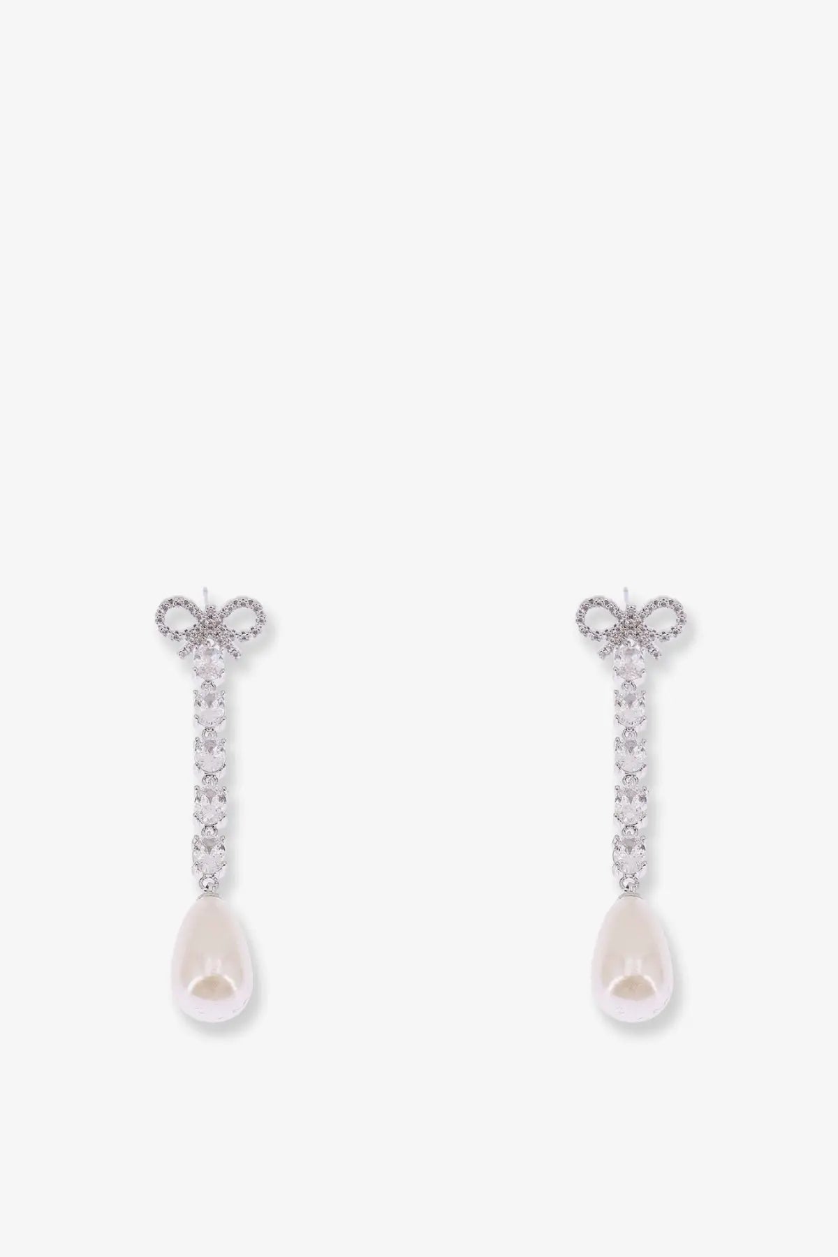 Silver bow-shaped brass earrings for women adorned with sparkling crystals and dangling teardrop pearls
