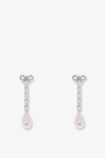 Silver bow-shaped brass earrings for women adorned with sparkling crystals and dangling teardrop pearls