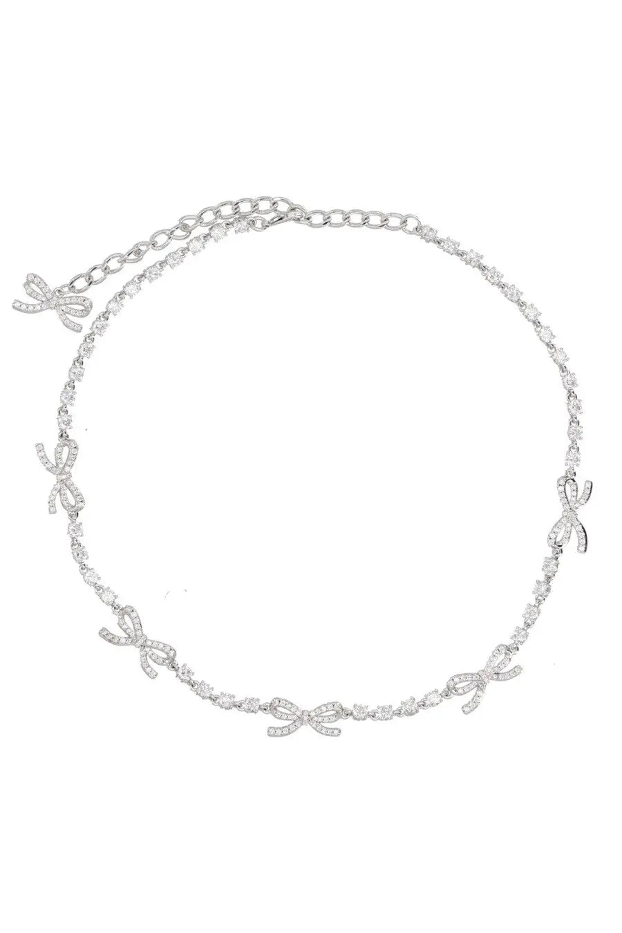 A delicate silver chain necklace with sparkling diamond-encrusted bow charms from self-portrait women’s collection