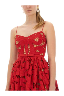 A vibrant red lace self-portrait womens embroidered midi dress with a cut-out bow design and thin spaghetti straps