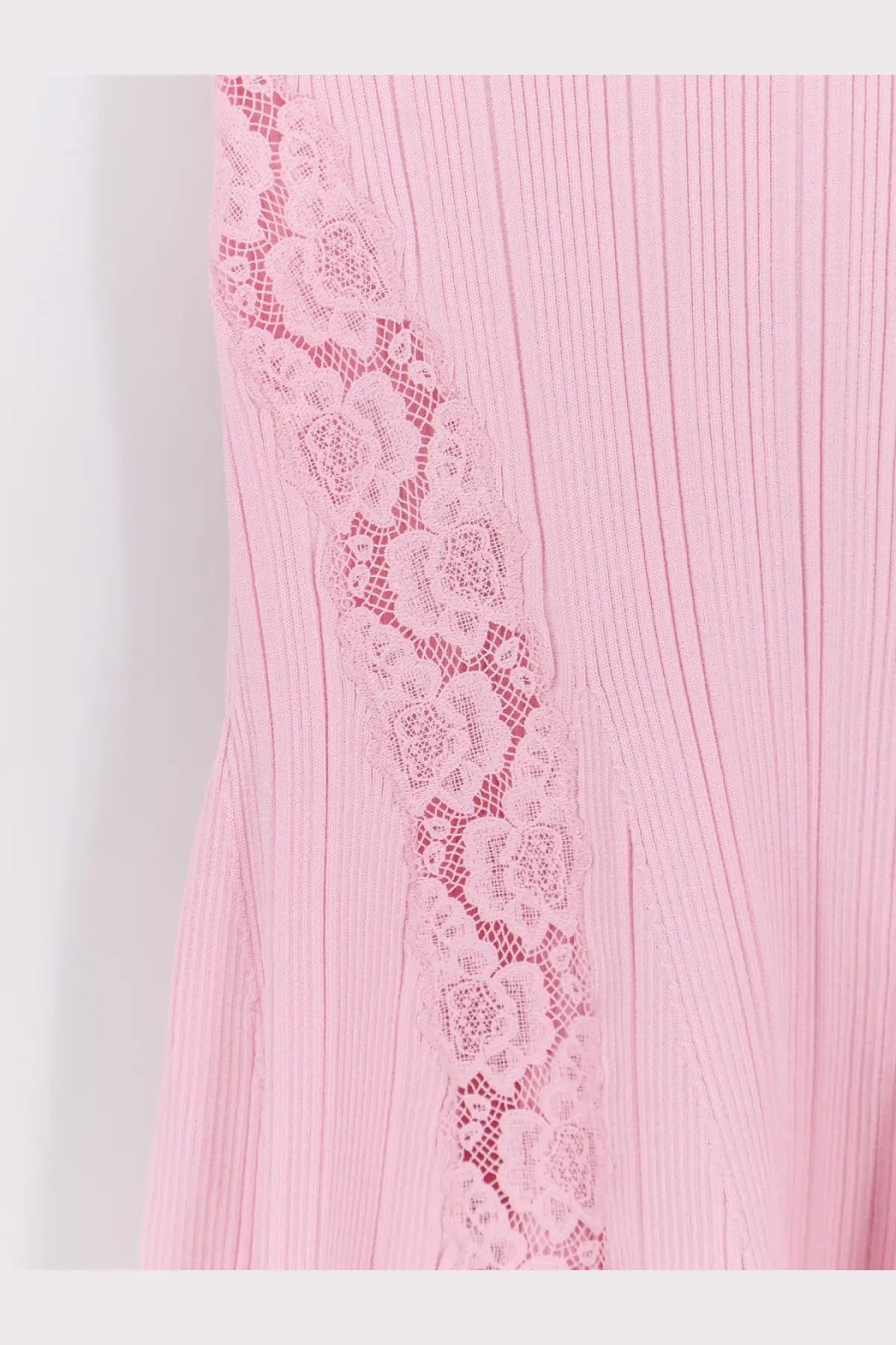 A delicate pink ribbed knit midi dress with floral lace trim along the side by Self-Portrait