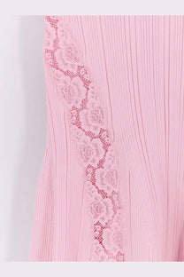 A delicate pink ribbed knit midi dress with floral lace trim along the side by Self-Portrait