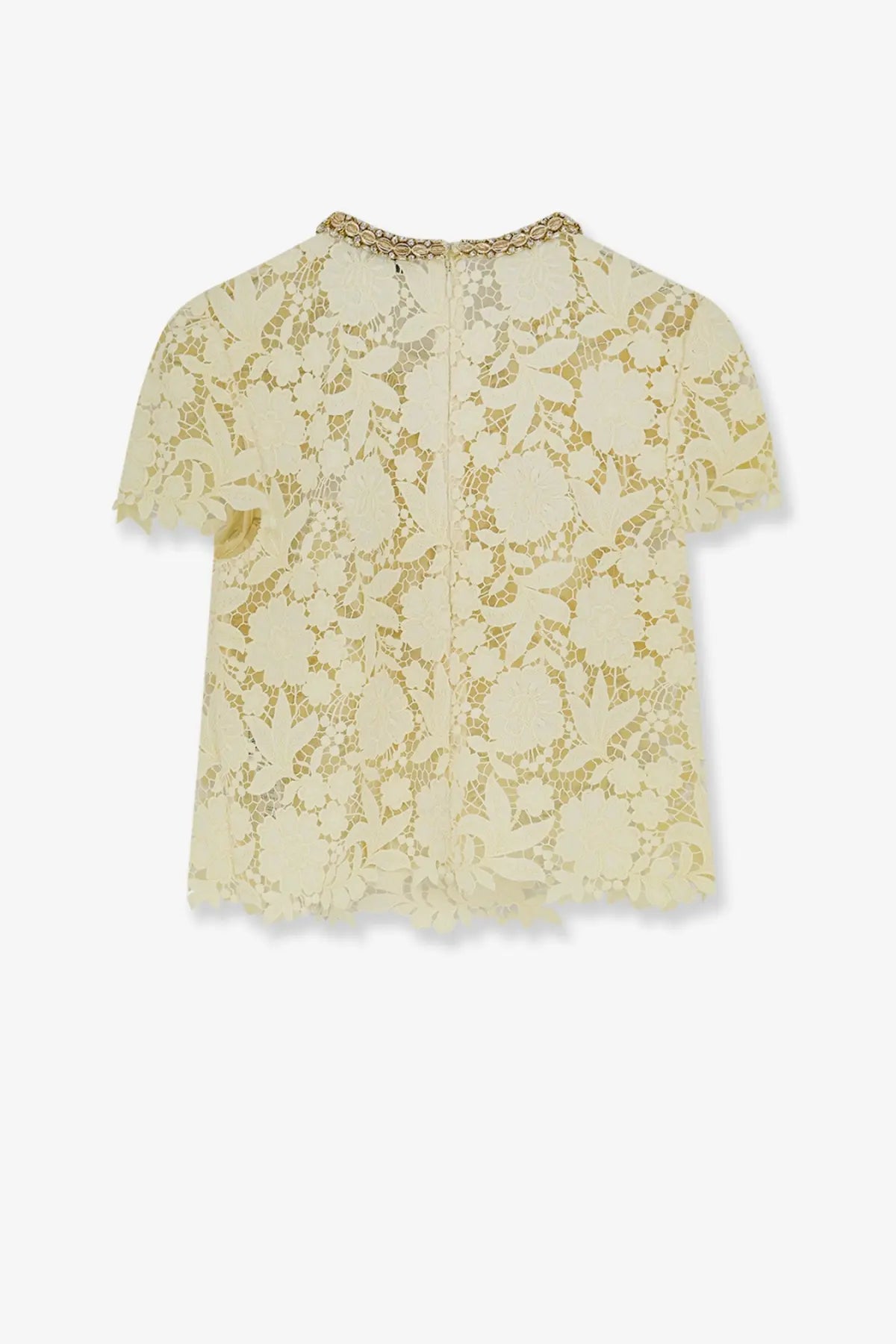 A delicate cream-colored lace short sleeve top with a decorative gold-trimmed neckline by Self-Portrait
