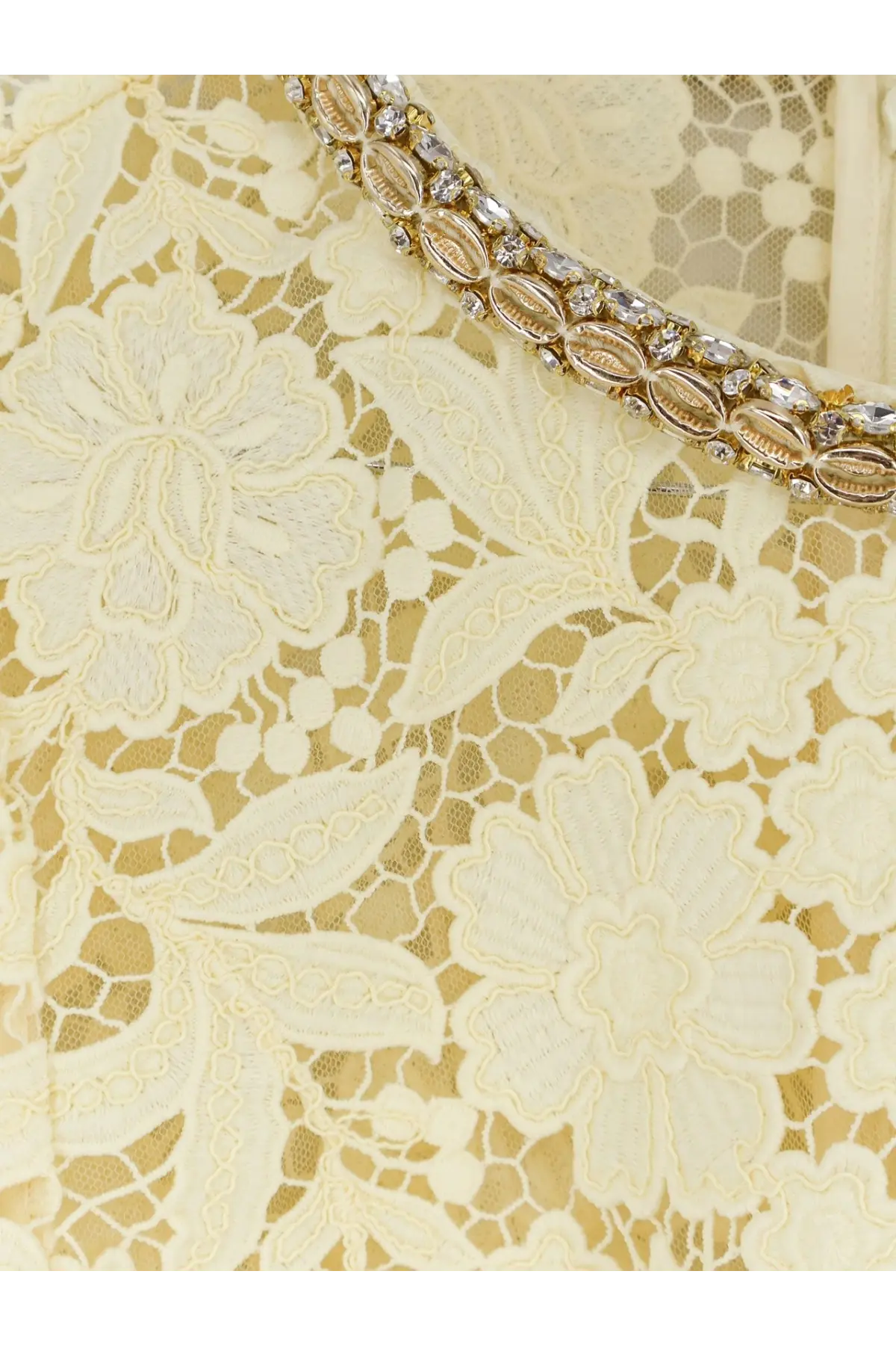 A delicate cream lace dress with an ornate gold beaded collar and clear crystal embellishments by self-portrait