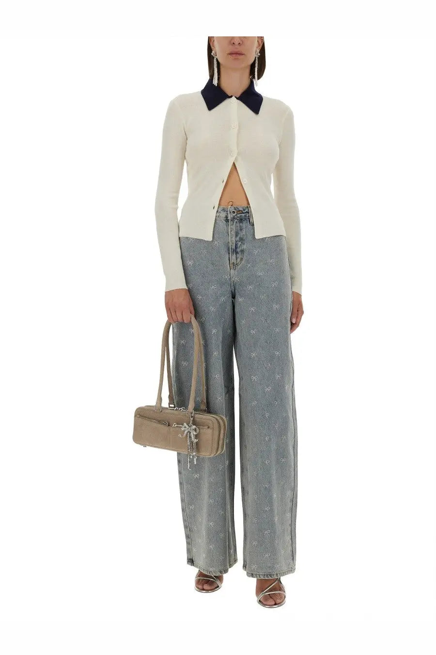 Beige structured handbag with top handles and decorative bow detail paired with self-portrait white merino wool cardigan