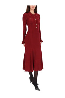 A rich burgundy ribbed knit midi dress by self-portrait with a collar, front buttons, and flared sleeves
