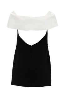 Self portrait women’s mini dress in black with a v-neckline and white satin-like fabric draped over the shoulders