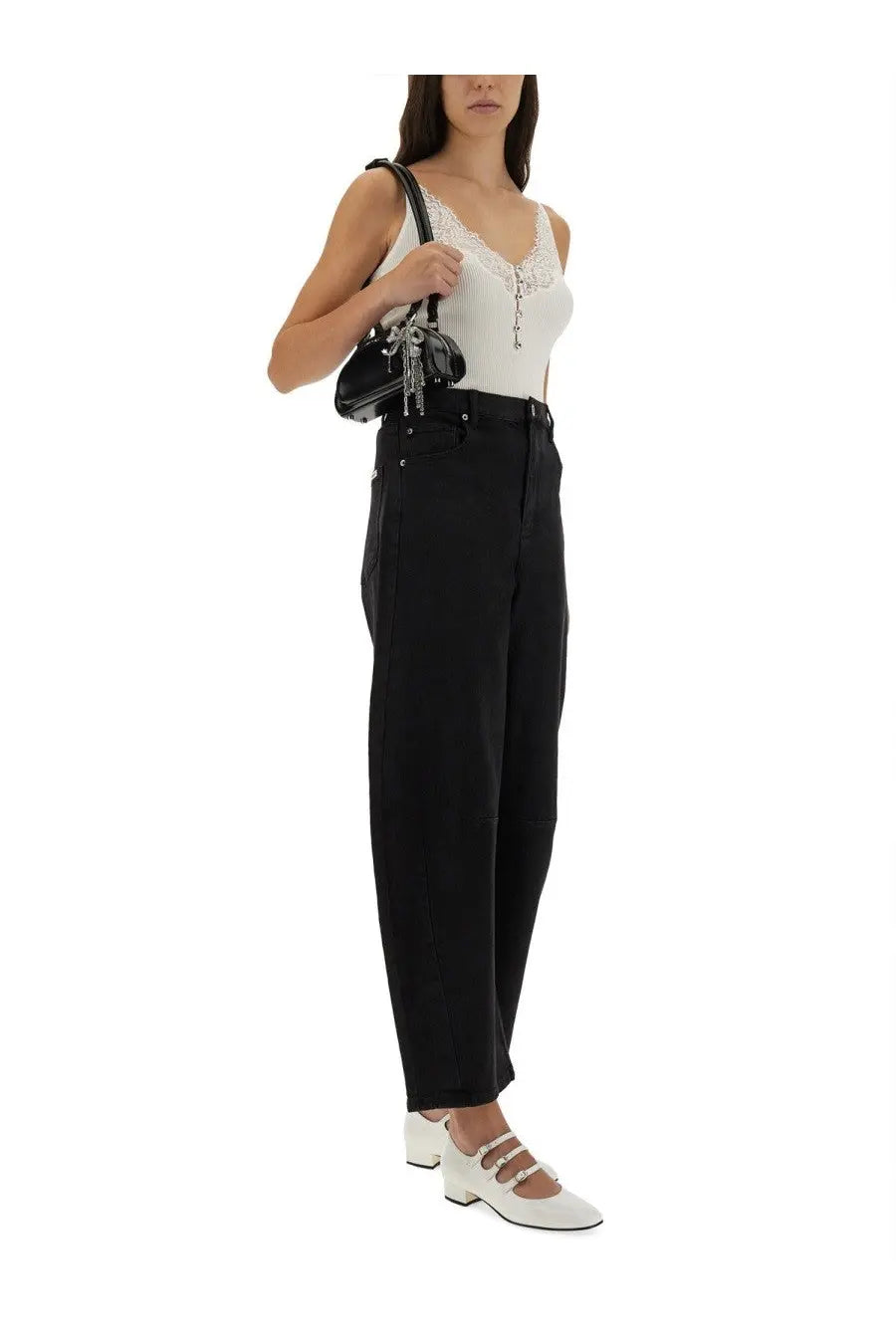 Black structured shoulder bag with silver chain detailing and glossy finish paired with self-portrait white ribbed knit top