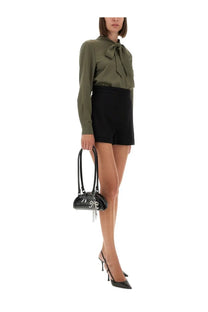 Black glossy handbag with silver chain and charm detail paired with self-portrait women’s green twill shirt