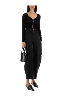 Black patent leather bucket bag with silver chain and keychain detail paired with self-portrait womens viscose knit top black