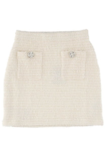 Cream-colored wool tweed miniskirt by self-portrait featuring two front pockets with crystal buttons