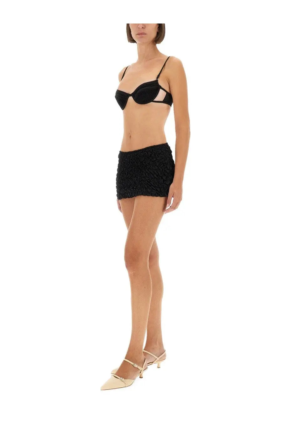 Selia Richwood women’s black satin bra with sheer mesh panels and matching black textured mini skirt front view