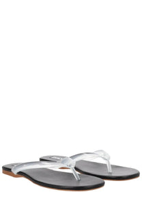 Clear plastic thong sandals with black rubber soles and subtle brand tag on the heel by senso women