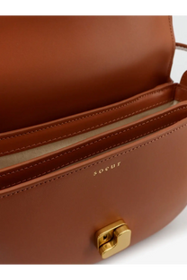 Tan leather soeur women’s bellissima mini crossbody bag with gold-tone clasp and embossed brand name on front