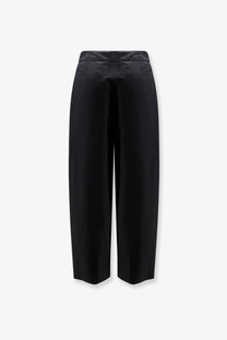 Black high-waisted wide-leg trousers with a sleek tailored silhouette made of organic cotton and linen by Soeur