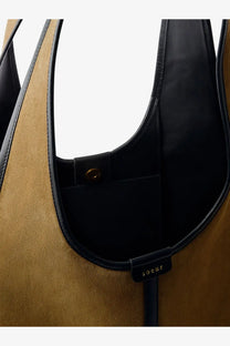 Soeur women’s douce bronze shoulder bag in tan suede with black leather trim and small branded tag