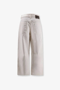 Beige wide-leg denim trousers with a relaxed fit and classic back pockets shown from the back by soeur women’s eliott denim trousers white
