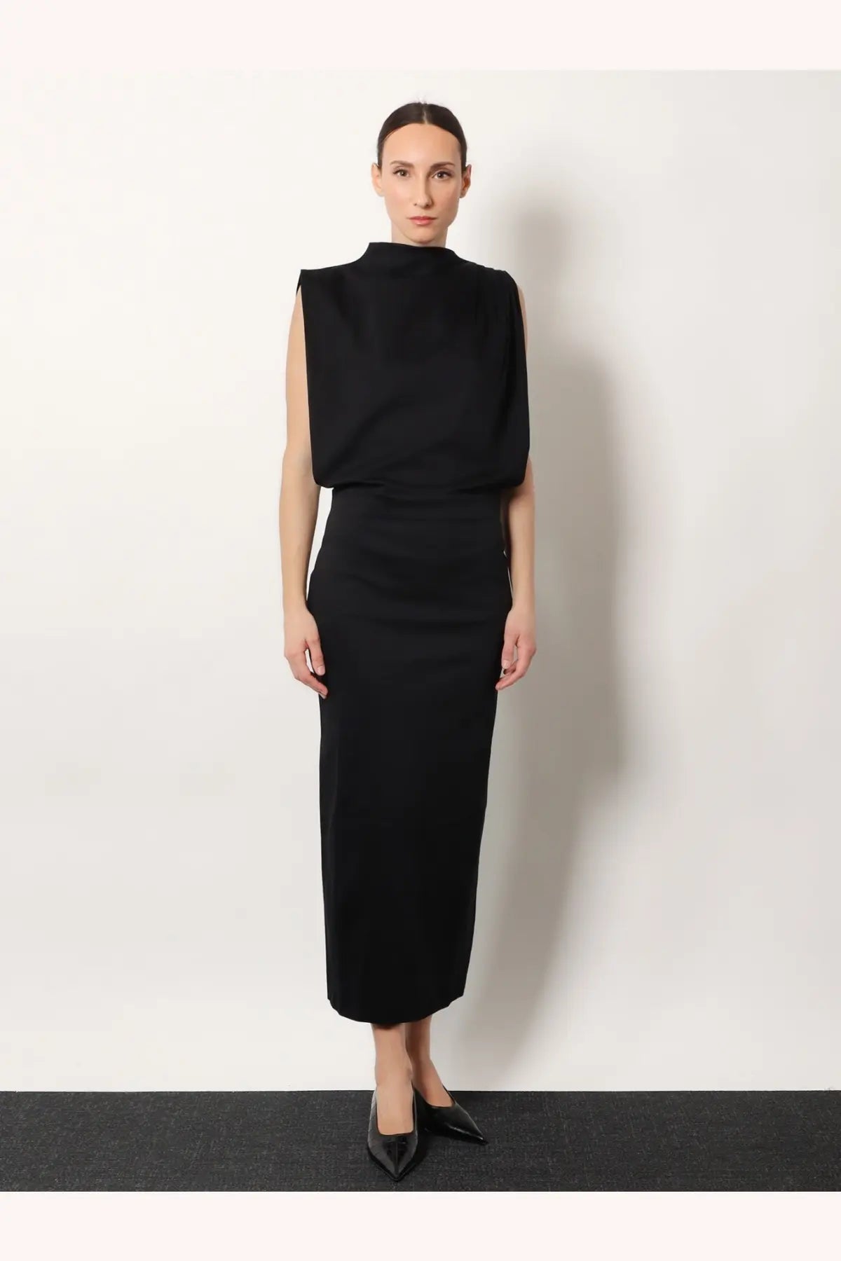 Black sleeveless high neck midi dress with structured bodice and fitted skirt by Soeur in organic cotton