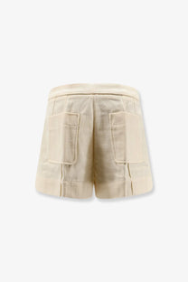 Beige textured cotton shorts for women by soeur with two large patch pockets in crème color
