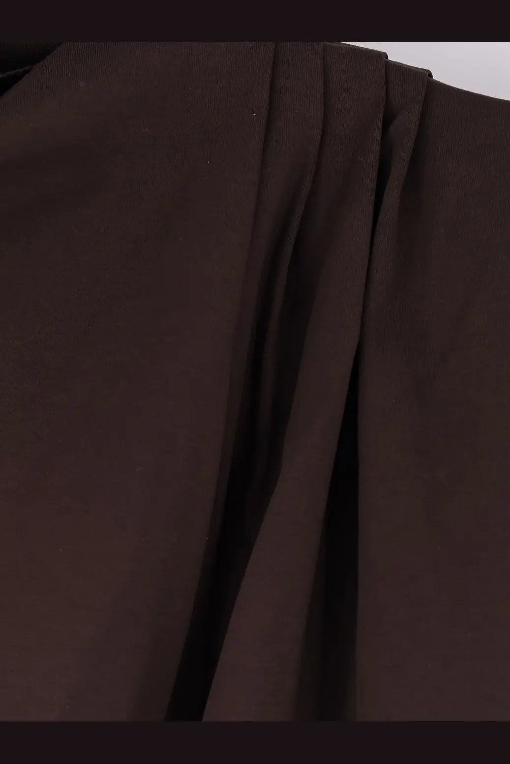 Dark brown pleated organic cotton fabric with a smooth textured surface in soeur womens idris top
