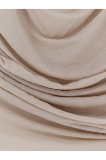 A soft flowing beige scarf made of lightweight extra fine cotton crepe in soeurs irina mastic collection