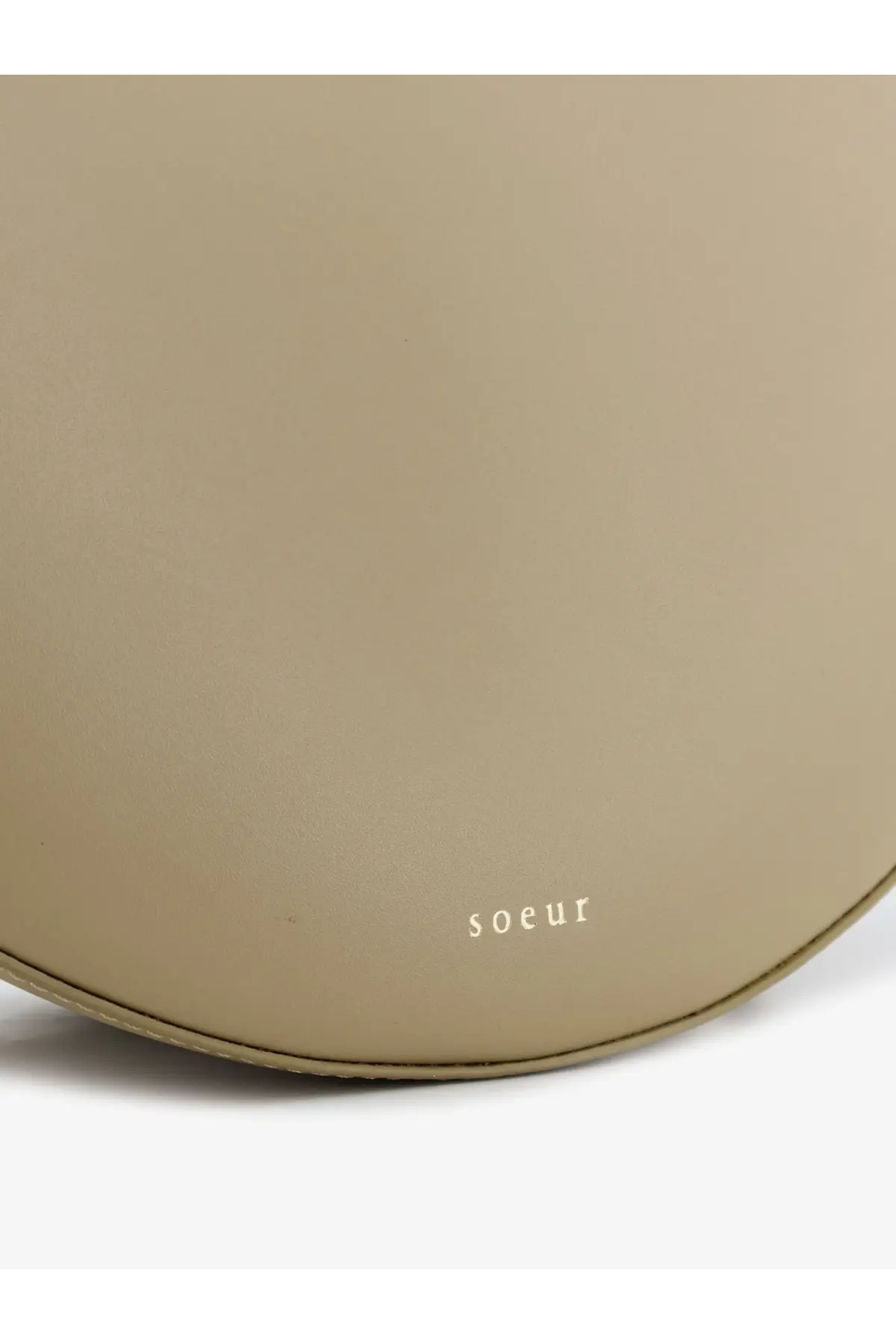 Beige leather round crossbody handbag with subtle soeur branding in the winona women’s collection