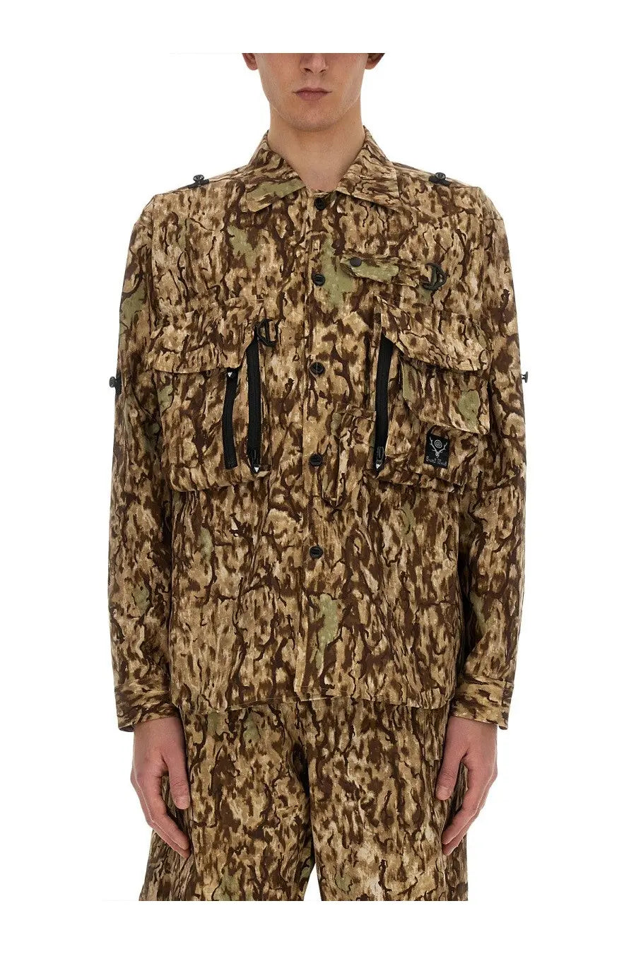 South2 west8 men’s camouflage print jacket in brown and beige with black zipper pulls and brand patch on left chest