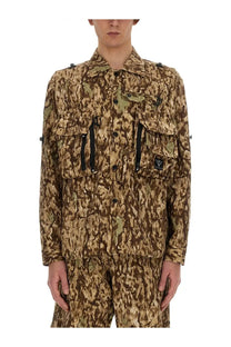 South2 west8 men’s camouflage print jacket in brown and beige with black zipper pulls and brand patch on left chest