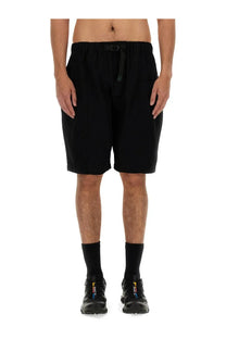 South2 West8 men’s twill Bermuda shorts in black with a drawstring waistband and subtle pleats for a relaxed fit