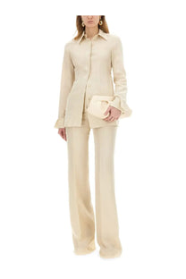 Cream-colored satin blazer with flared sleeves and matching wide-leg trousers from Sportmax women’s pants hourly beige