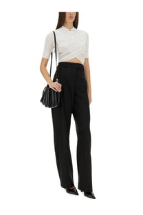 Black quilted leather mini bag with slender shoulder strap complementing sportmax women’s top shaker white