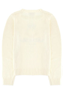 Cream-colored ribbed knit sweater with classic crew neck and long sleeves in sporty and rich unisex jersey white style
