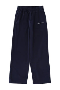 Sporty &amp; Rich unisex navy blue athletic pants with elastic waistband and white embroidered logo on left thigh
