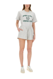 Sporty &amp; rich unisex short varsity grey tee with green embroidered crest and lettering in a sporty country club style