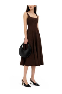 Black leather crescent-shaped handbag featured with Staud women’s Abito midi Wells brown dress