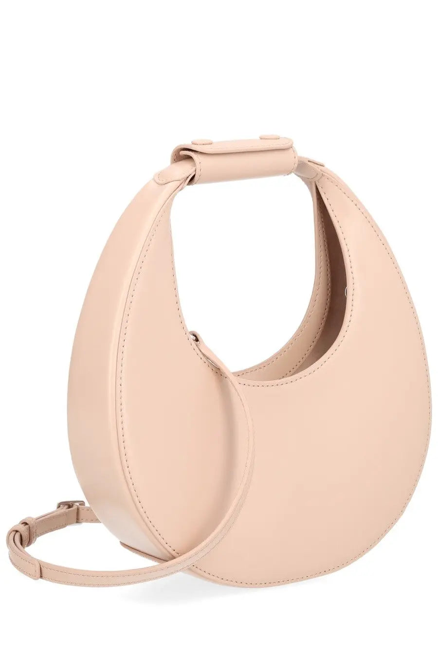 A sleek blush pink leather handbag with minimalist design and curved top handle from Staud Women’s Borsa Moon Mini