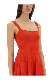 Staud women’s Ellison short dress in vibrant orange ribbed knit with sleeveless square neckline and pleated skirt