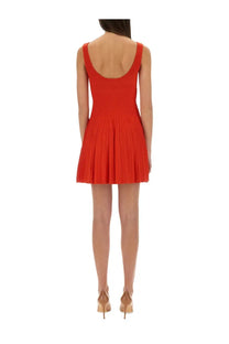 A vibrant red sleeveless pleated mini dress with a fitted bodice and flared skirt by Staud Women Ellison Short Dress