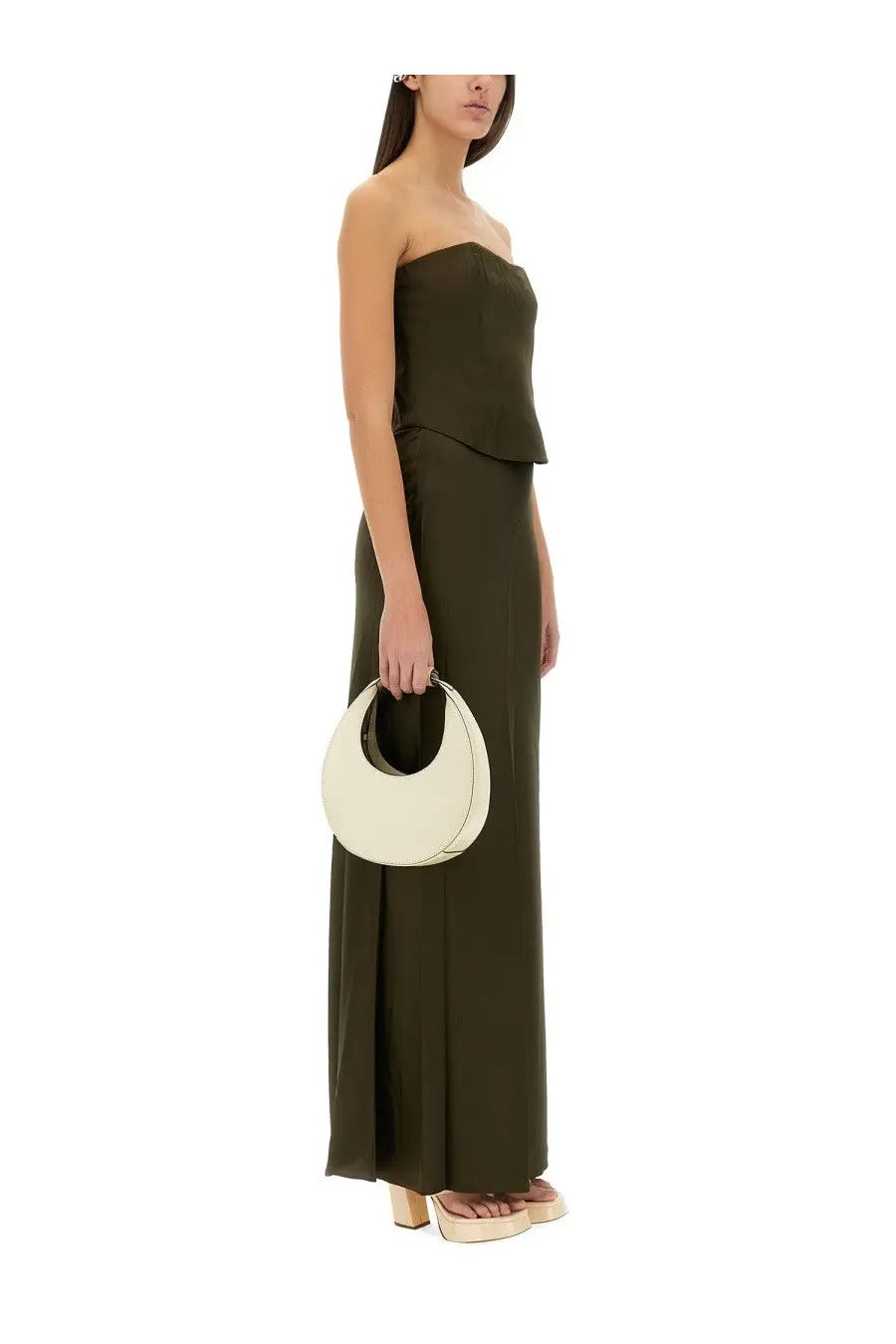 Cream-colored minimalist crescent-shaped leather handbag paired with staud women’s odin skirt green product image