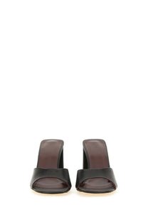 Black leather mule sandals with glossy finish and block heel by Staud in black for women