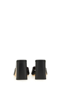 Staud women’s black leather sandal sloane with block heel and minimalist mule design shown from the back side