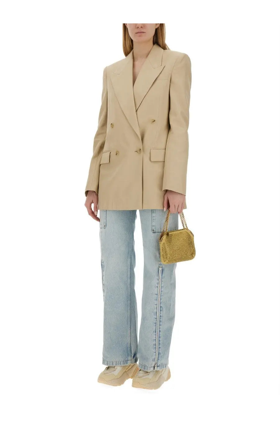 Gold chain-strap mini bag with textured glittery surface paired with stella mccartney women’s blue cargo jeans