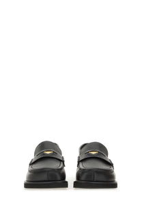 Stella McCartney women’s classic loafer Ryder black with black leather and gold-tone heart-shaped emblem on front