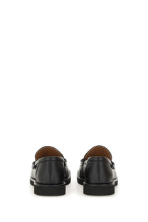 Stella McCartney women’s classic loafer Ryder black leather with sleek minimalist design and contrasting tan lining