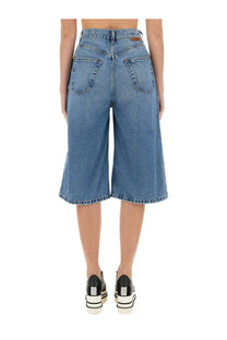 Stella mccartney women’s denim bermuda shorts in medium blue high-waisted culottes with flared leg and classic back pockets viewed from back