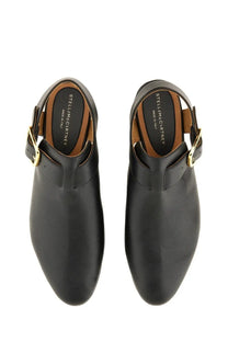 Black leather caged mules with gold tone buckle details from Stella McCartney women’s Elyse sandal collection